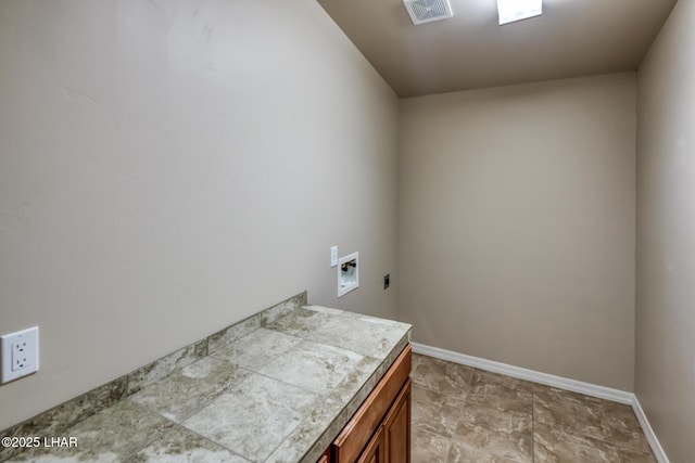 879 Window Rock Plz, Lake Havasu City, AZ 86406 - laundry room with hookup for a washing machine, electric dryer hookup, and cabinet space