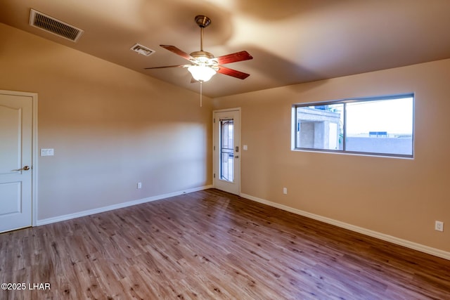 879 Window Rock Plz, Lake Havasu City, AZ 86406 - empty room featuring wood finished floors, a ceiling fan, and vaulted ceiling