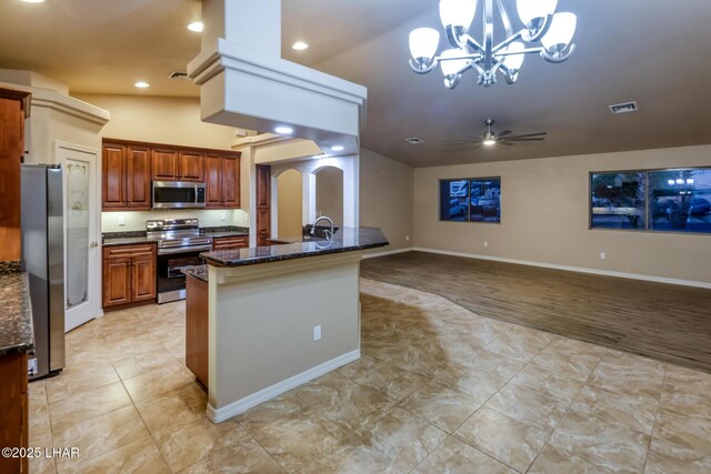 879 Window Rock Plz, Lake Havasu City, AZ 86406 - kitchen featuring appliances with stainless steel finishes, a chandelier, dark stone countertops, light tile patterned floors, and recessed lighting