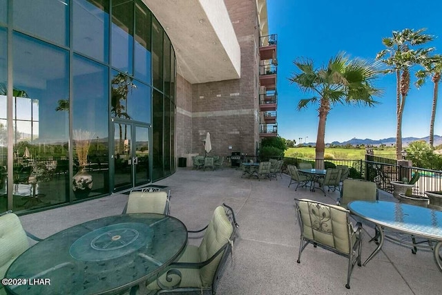 view of patio / terrace with a mountain view