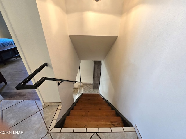 stairway featuring tile patterned floors