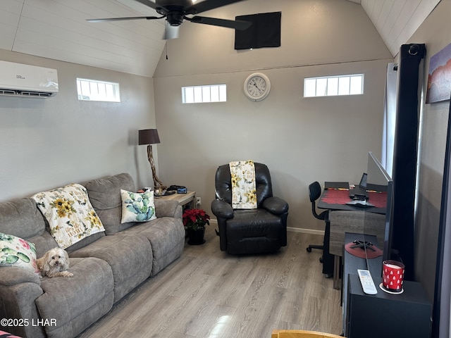 living area with plenty of natural light, wood finished floors, vaulted ceiling, and a wall mounted AC