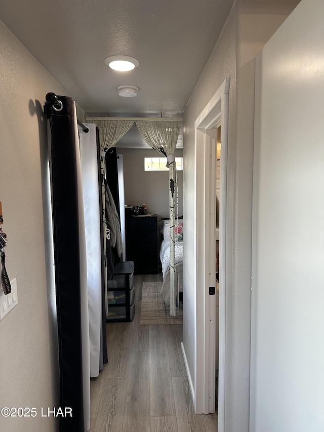 hallway featuring wood finished floors