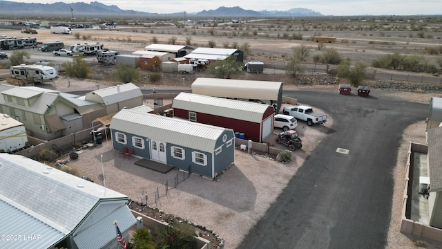 birds eye view of property featuring a mountain view