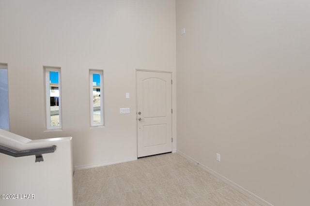 entrance foyer with a towering ceiling