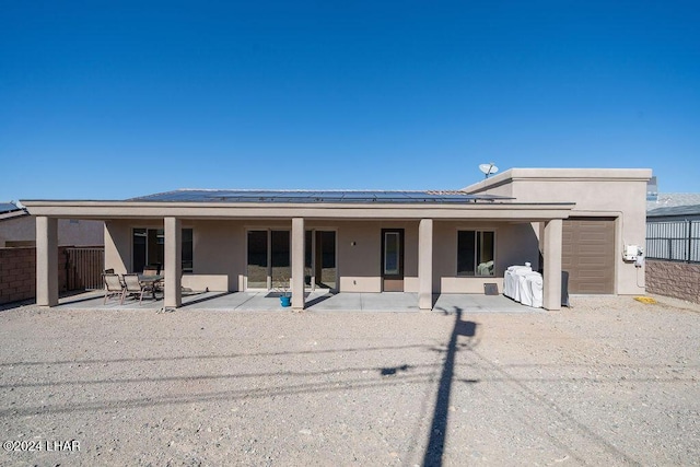 rear view of house featuring a patio