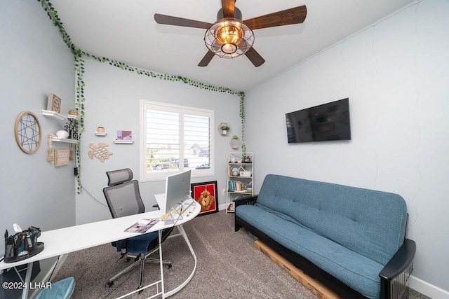 carpeted office space with ceiling fan