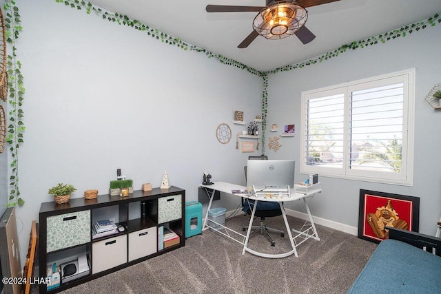 carpeted office space featuring ceiling fan