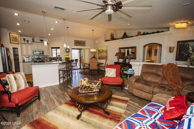 2870 Havasupai Blvd, Lake Havasu City, AZ 86404 - living room with vaulted ceiling, wood finished floors, a ceiling fan, recessed lighting, and arched walkways
