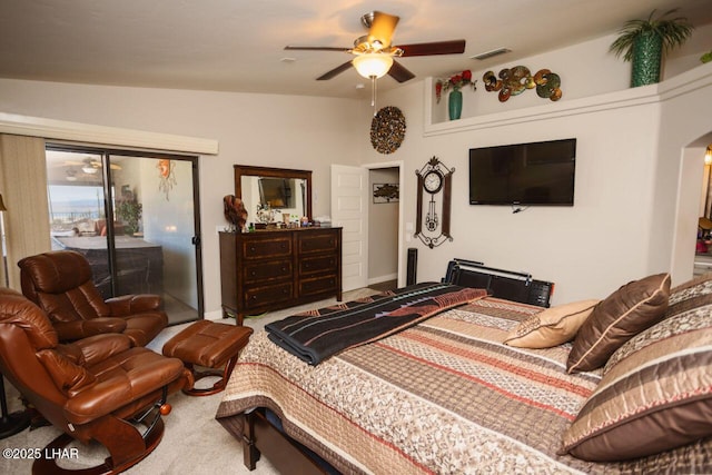 2870 Havasupai Blvd, Lake Havasu City, AZ 86404 - carpeted bedroom featuring access to exterior, arched walkways, and ceiling fan