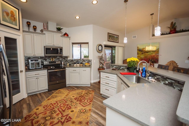 2870 Havasupai Blvd, Lake Havasu City, AZ 86404 - kitchen with appliances with stainless steel finishes, a sink, backsplash, dark wood-style floors, and recessed lighting