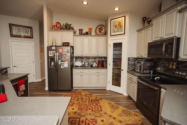 2870 Havasupai Blvd, Lake Havasu City, AZ 86404 - kitchen with appliances with stainless steel finishes, tasteful backsplash, recessed lighting, dark wood-style flooring, and lofted ceiling