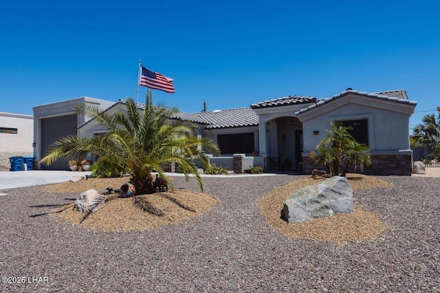 2870 Havasupai Blvd, Lake Havasu City, AZ 86404 - view of front of property with a tiled roof, stucco siding, an attached garage, and driveway