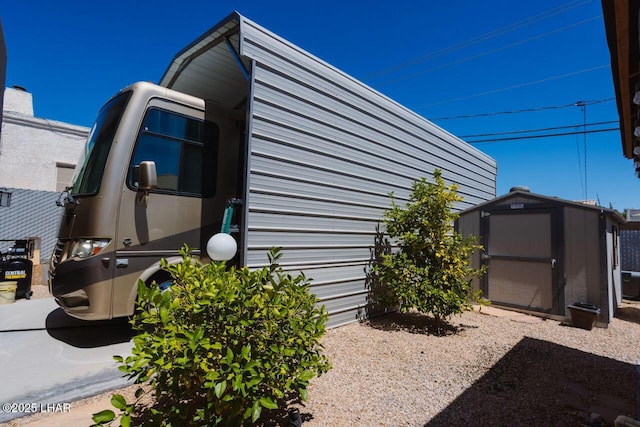 2870 Havasupai Blvd, Lake Havasu City, AZ 86404 - view of home's exterior with a storage shed and an outdoor structure