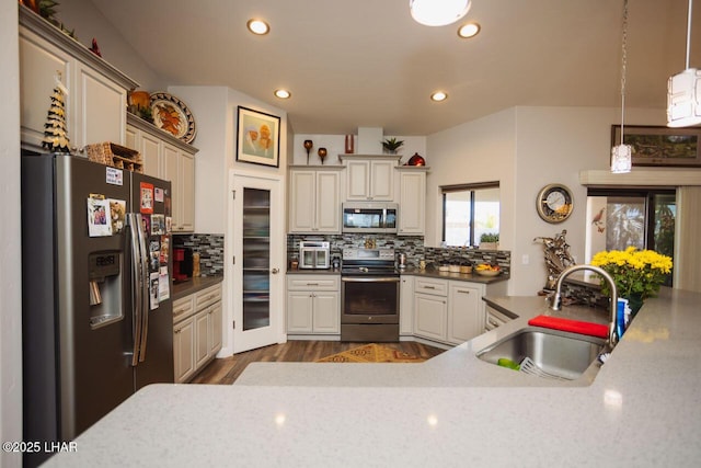 2870 Havasupai Blvd, Lake Havasu City, AZ 86404 - kitchen with appliances with stainless steel finishes, a sink, backsplash, recessed lighting, and dark wood finished floors