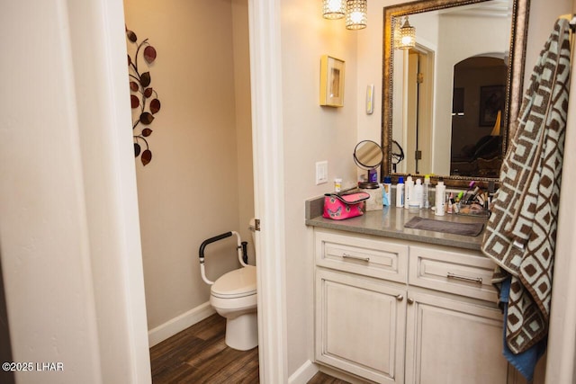 2870 Havasupai Blvd, Lake Havasu City, AZ 86404 - bathroom with toilet, baseboards, vanity, and wood finished floors