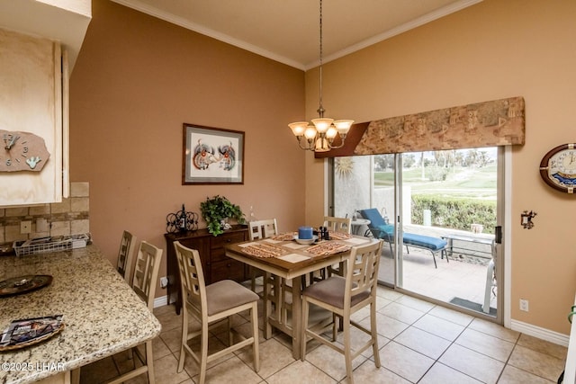 dining space featuring light tile patterned floors, baseboards, a notable chandelier, and ornamental molding