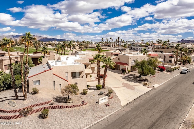 drone / aerial view with a mountain view and a residential view