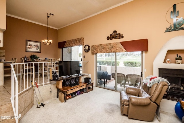 living room with visible vents, a notable chandelier, ornamental molding, carpet, and a fireplace