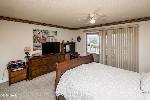 bedroom featuring access to exterior, light colored carpet, a textured ceiling, and ceiling fan