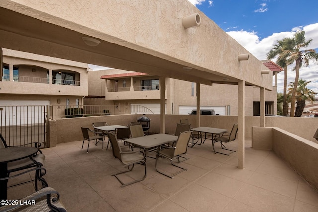 view of patio / terrace with outdoor dining space and fence