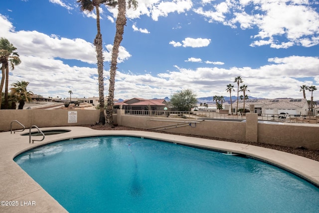 pool featuring a patio and fence