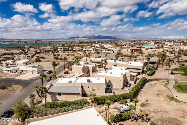 aerial view featuring a residential view and a water and mountain view