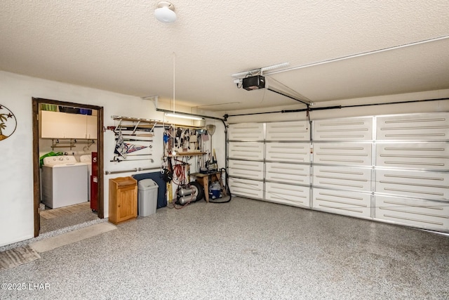 garage with washer / clothes dryer and a garage door opener