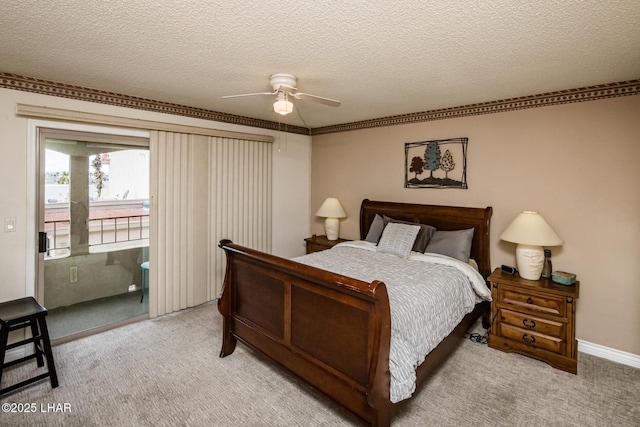 carpeted bedroom featuring a textured ceiling, a ceiling fan, and access to outside