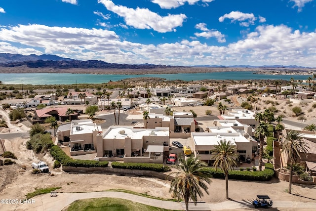 aerial view featuring a residential view and a water and mountain view