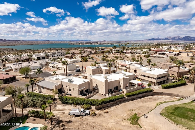 aerial view featuring a residential view and a water and mountain view