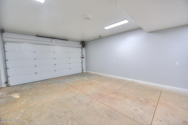 8551 River View Villas Dr Unit 15, Parker, AZ 85344 - garage featuring baseboards