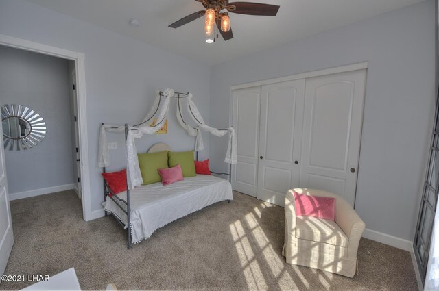 8551 River View Villas Dr Unit 15, Parker, AZ 85344 - bedroom featuring carpet, a closet, baseboards, and ceiling fan