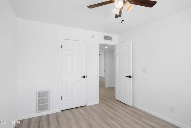 2870 Cisco Dr S, Lake Havasu City, AZ 86403 - unfurnished bedroom with light wood-type flooring and ceiling fan