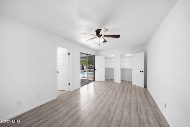 2870 Cisco Dr S, Lake Havasu City, AZ 86403 - unfurnished bedroom featuring access to exterior, wood finished floors, and ceiling fan