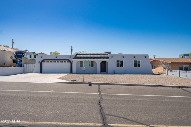 2870 Cisco Dr S, Lake Havasu City, AZ 86403 - view of front facade featuring stucco siding, driveway, and an attached garage