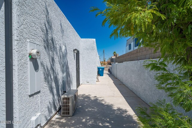 2870 Cisco Dr S, Lake Havasu City, AZ 86403 - view of home's exterior with stucco siding and an ac unit