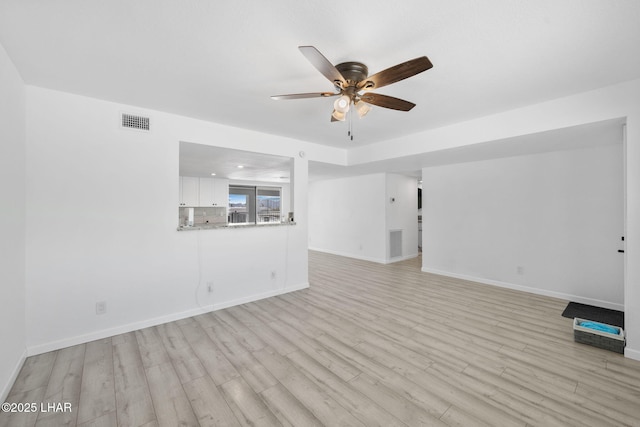 2870 Cisco Dr S, Lake Havasu City, AZ 86403 - unfurnished living room with ceiling fan and light wood-style flooring