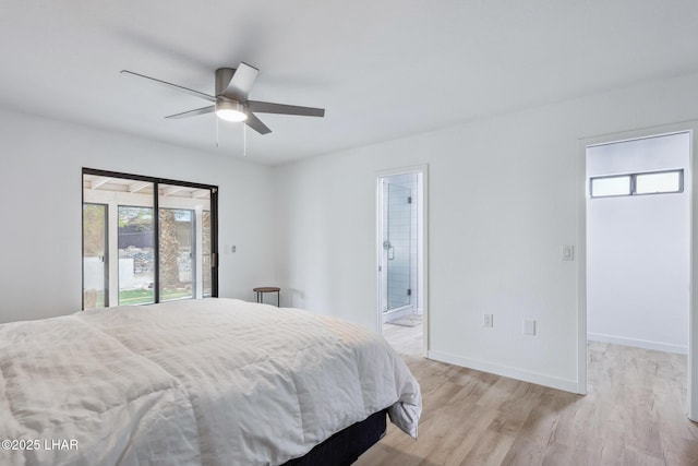 bedroom featuring a walk in closet, access to outside, connected bathroom, light wood-type flooring, and baseboards