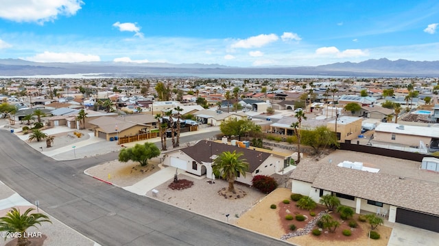 birds eye view of property with a residential view and a mountain view