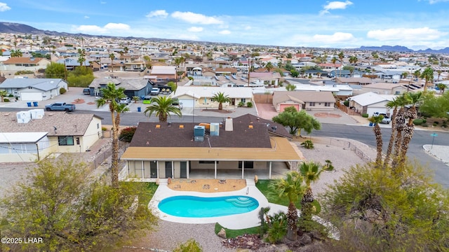 birds eye view of property with a mountain view and a residential view