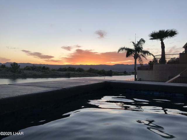 exterior space featuring a water and mountain view