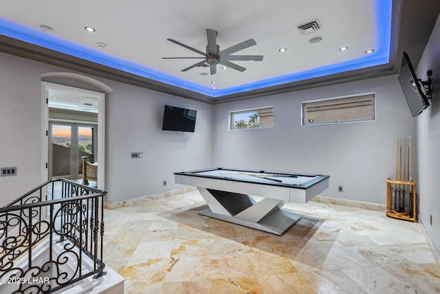 playroom featuring visible vents, a tray ceiling, recessed lighting, baseboards, and ceiling fan