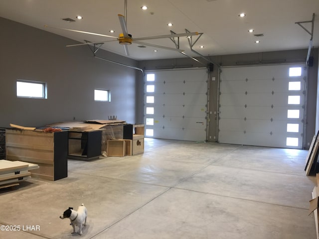 garage with recessed lighting and visible vents