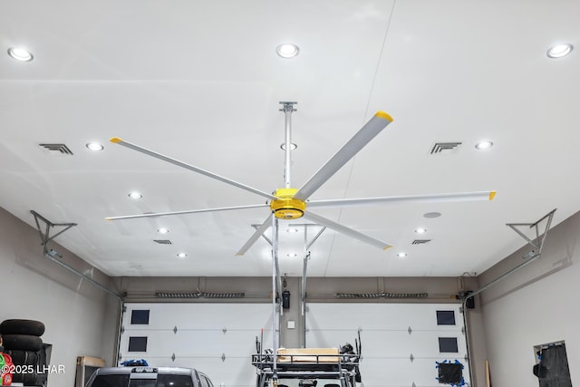 garage with recessed lighting and visible vents