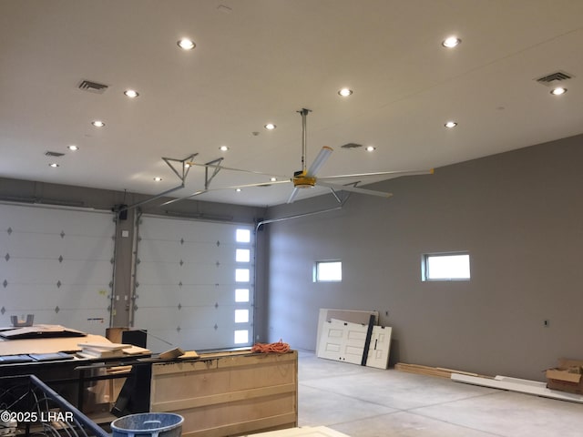 garage with visible vents, recessed lighting, and a ceiling fan