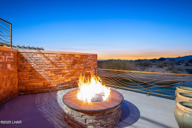 patio terrace at dusk with a fire pit