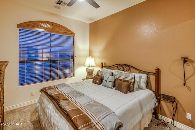 bedroom with carpet flooring, visible vents, baseboards, and ceiling fan