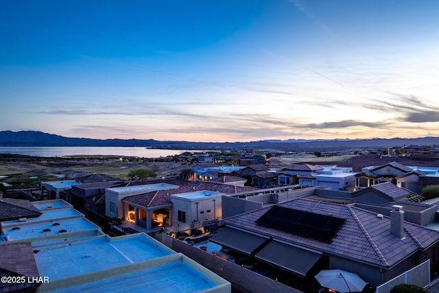 view of pool featuring a residential view and a water and mountain view