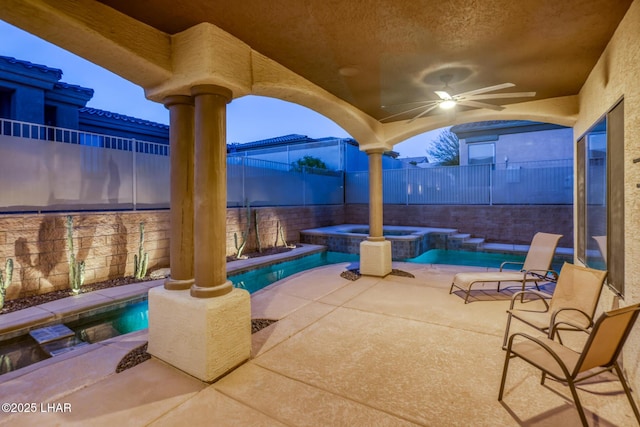 view of pool with a patio area, ceiling fan, a pool with connected hot tub, and a fenced backyard